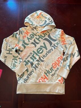 Hurley Allover Logo Hoodie in Cream, Teal & Orange